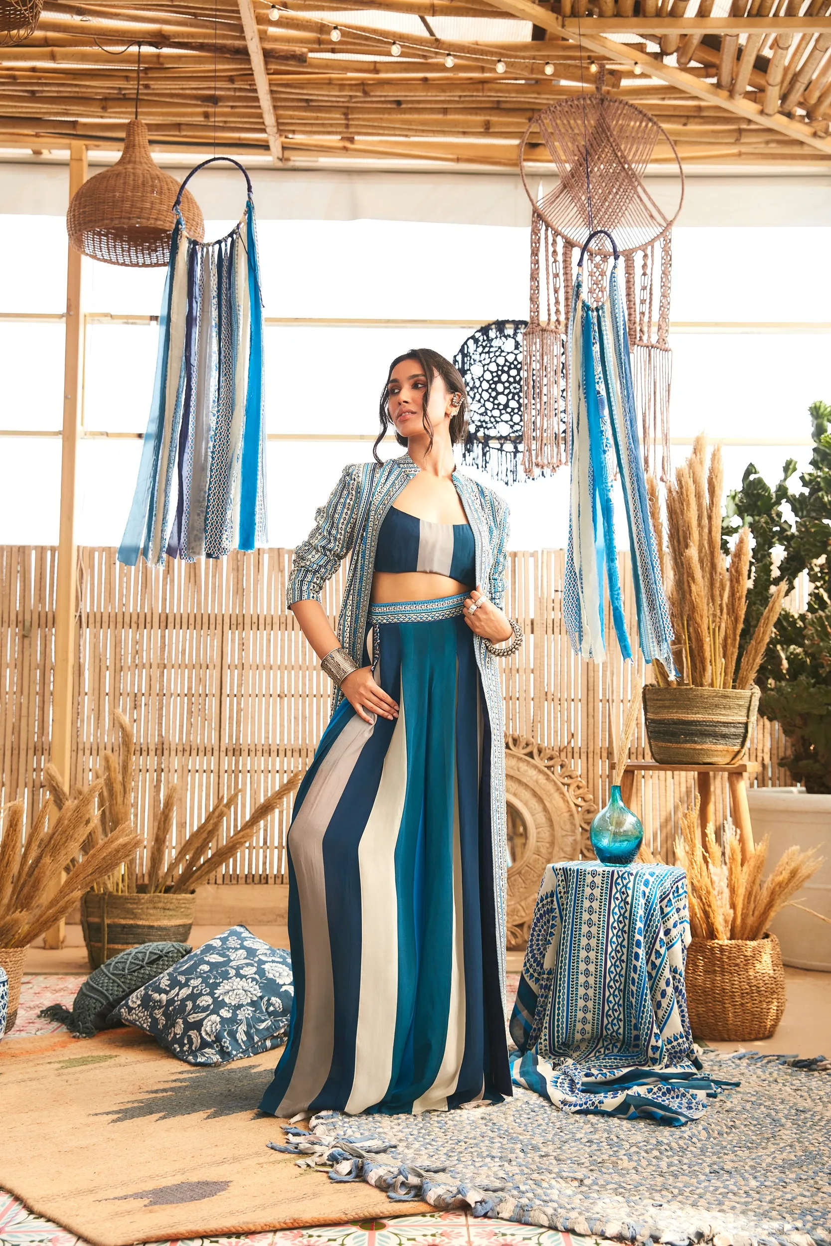 BLUE BOHO JACKET PAIRED WITH BUSTIER AND PLEATED PANTS